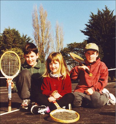 Sean (10), Beth (5) and Liam (7) Farrall take a break from practising their shots at the new Spencerville tennis court. 
