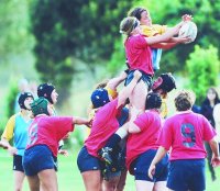 Massey (in red) and Otago contest possession during a rugby match at last year's university games in Wellington.  Otago went on to win the competition.