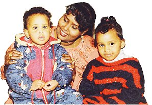 Anab with two of her children Ikram (one-and-a-half) and (Halima (aged three-and-a-half)