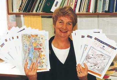 Children's advocate Lyn Campbell with colourful submissions sent in by children