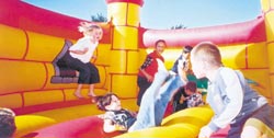 Children in a bouncy castle