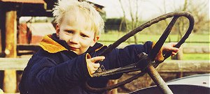 Three-year-old Sam Leeming Holmes,of Christchurch,has one of his first tastes of driving�an old tractor at Willowbank Wildlife Reserve.