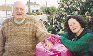 John Chambers and Ofelia Suarez- Chambers with part of their winnings from the Councils energy home.