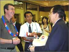 Mayor Garry Moore meets Akihiro Takahashi (74) a survivor of the atomic bombing of Hiroshima.  Hiroshima 6th August 2005.